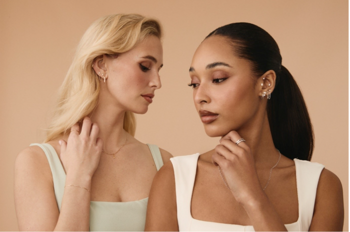 Two women wearing Tish Lyon earrings in an ear stack style